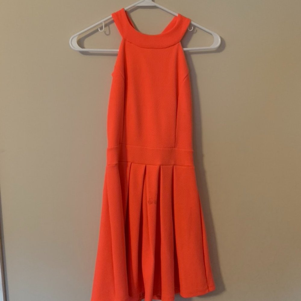 Hot pink dress, with bow in back.